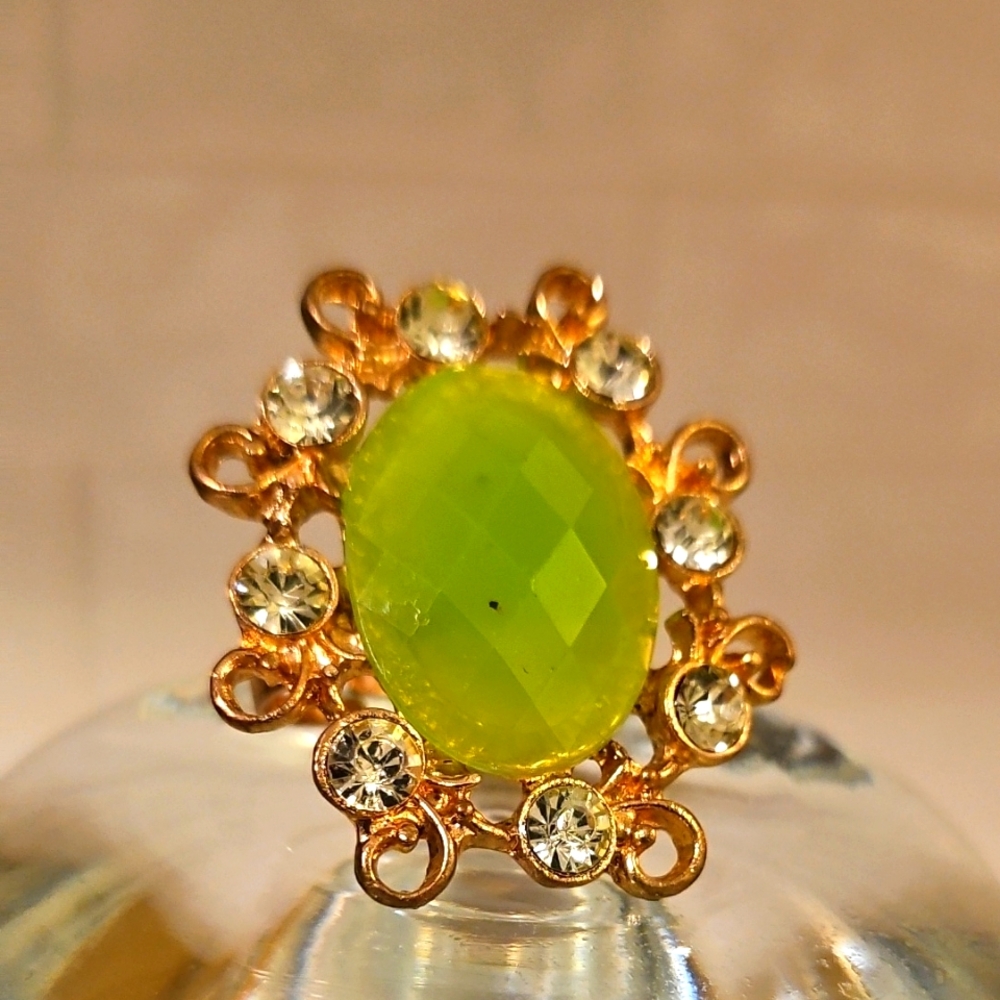 Vibrant Green Gemstone Ring with Golden Halo